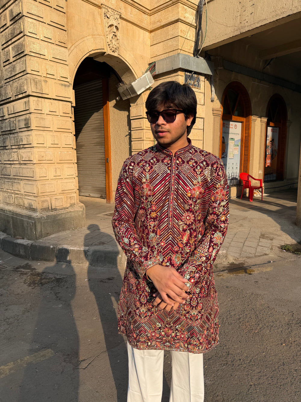Royal maroon festive kurta for men featuring intricate embroidery